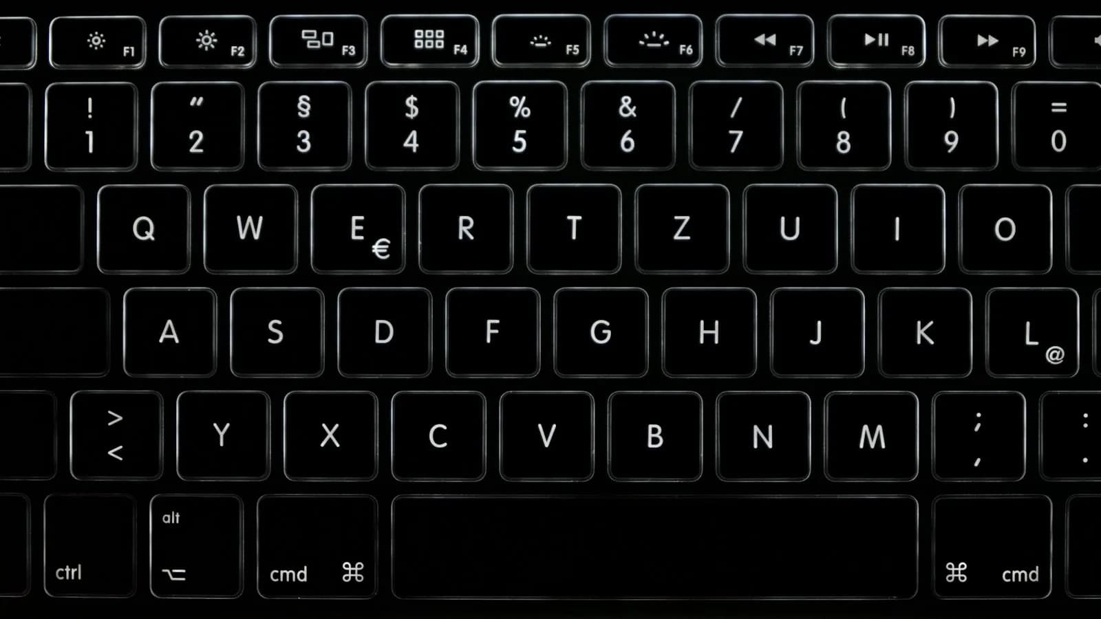 Hands typing a long question on a laptop keyboard