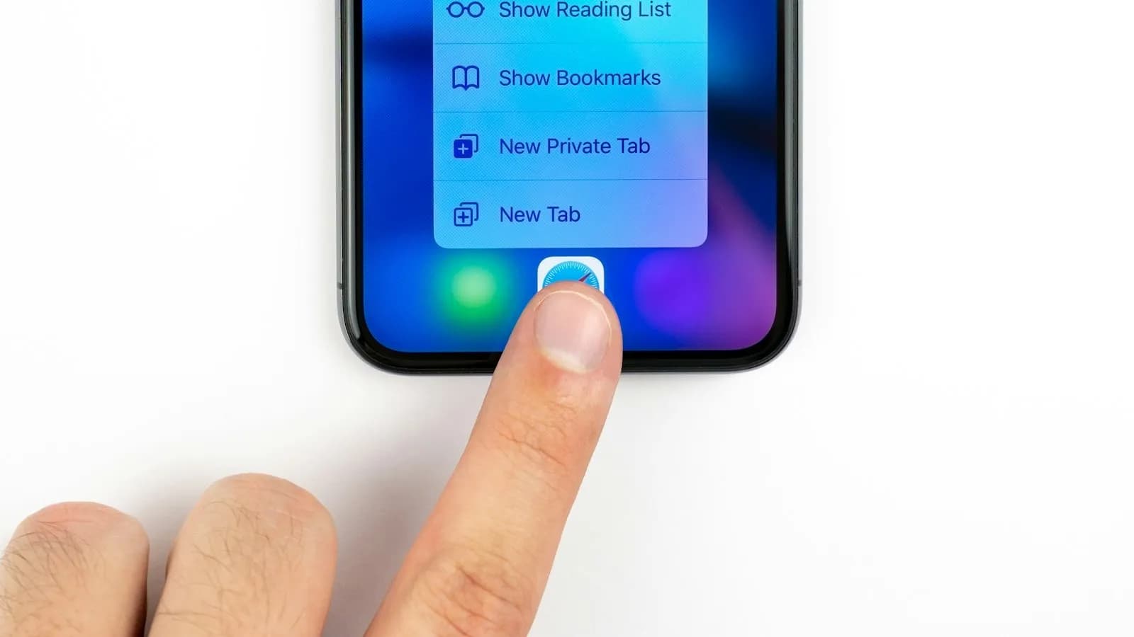 A thumb tapping a button on an iPhone screen