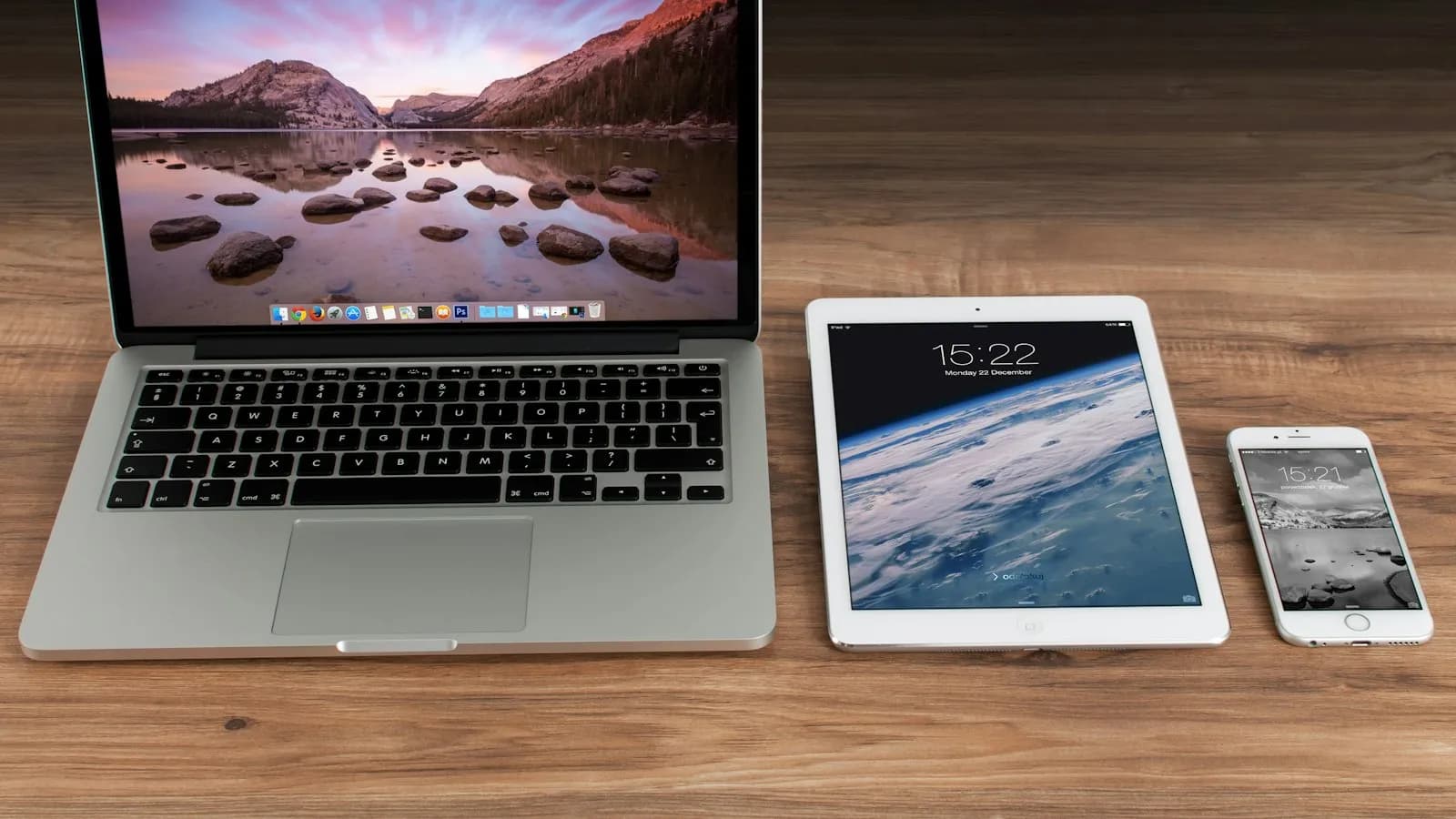 A laptop, tablet and smartphone showing the same website side by side