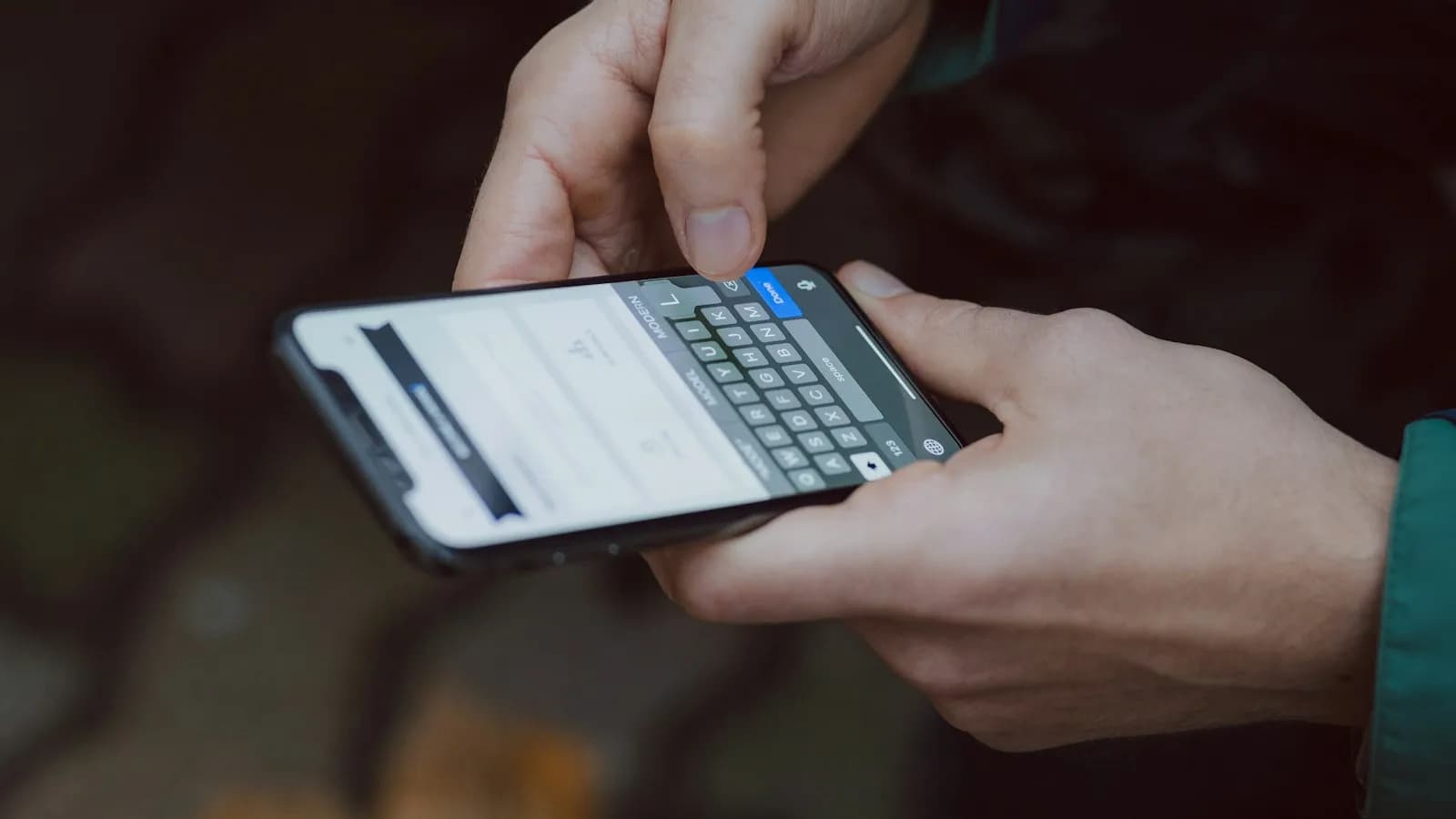 A person reading search results on a smartphone