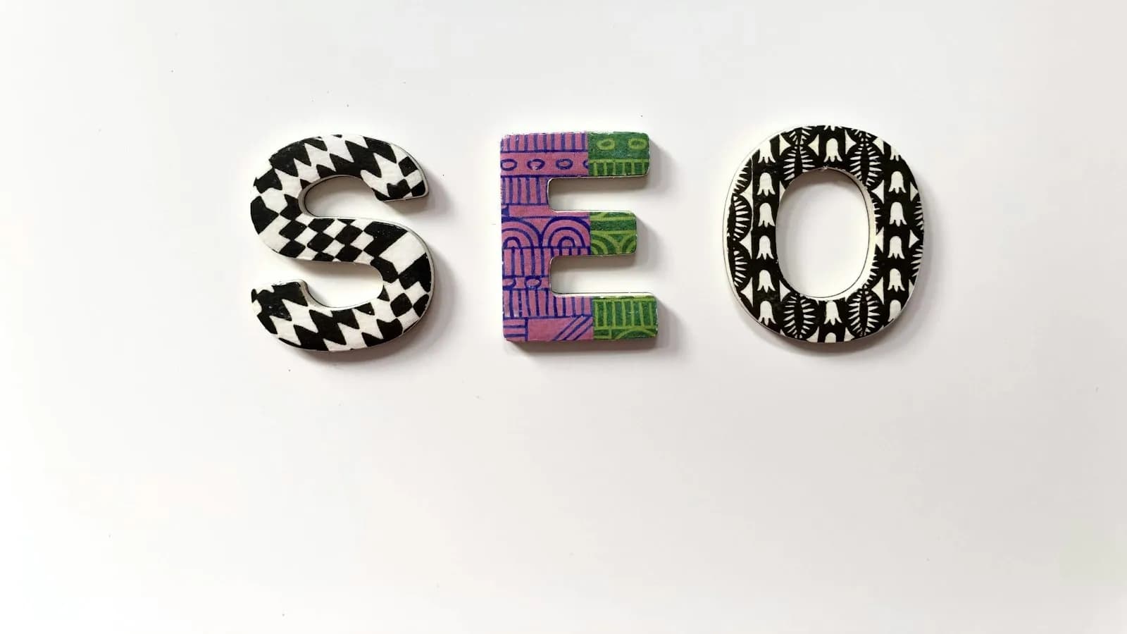 The letters S, E and O in bold patterned blocks on a white background