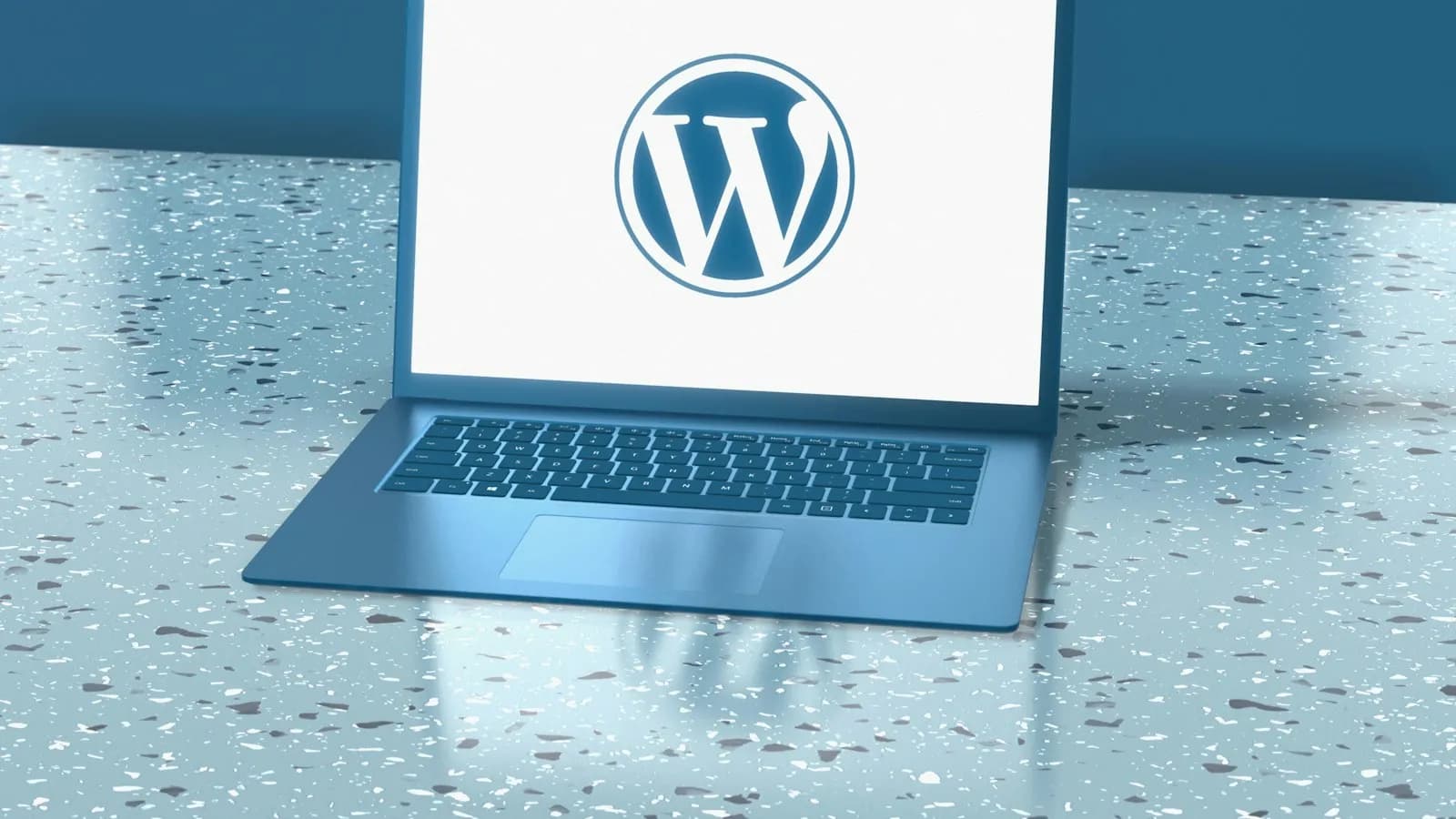 A blue laptop showing the WordPress logo on a speckled blue surface
